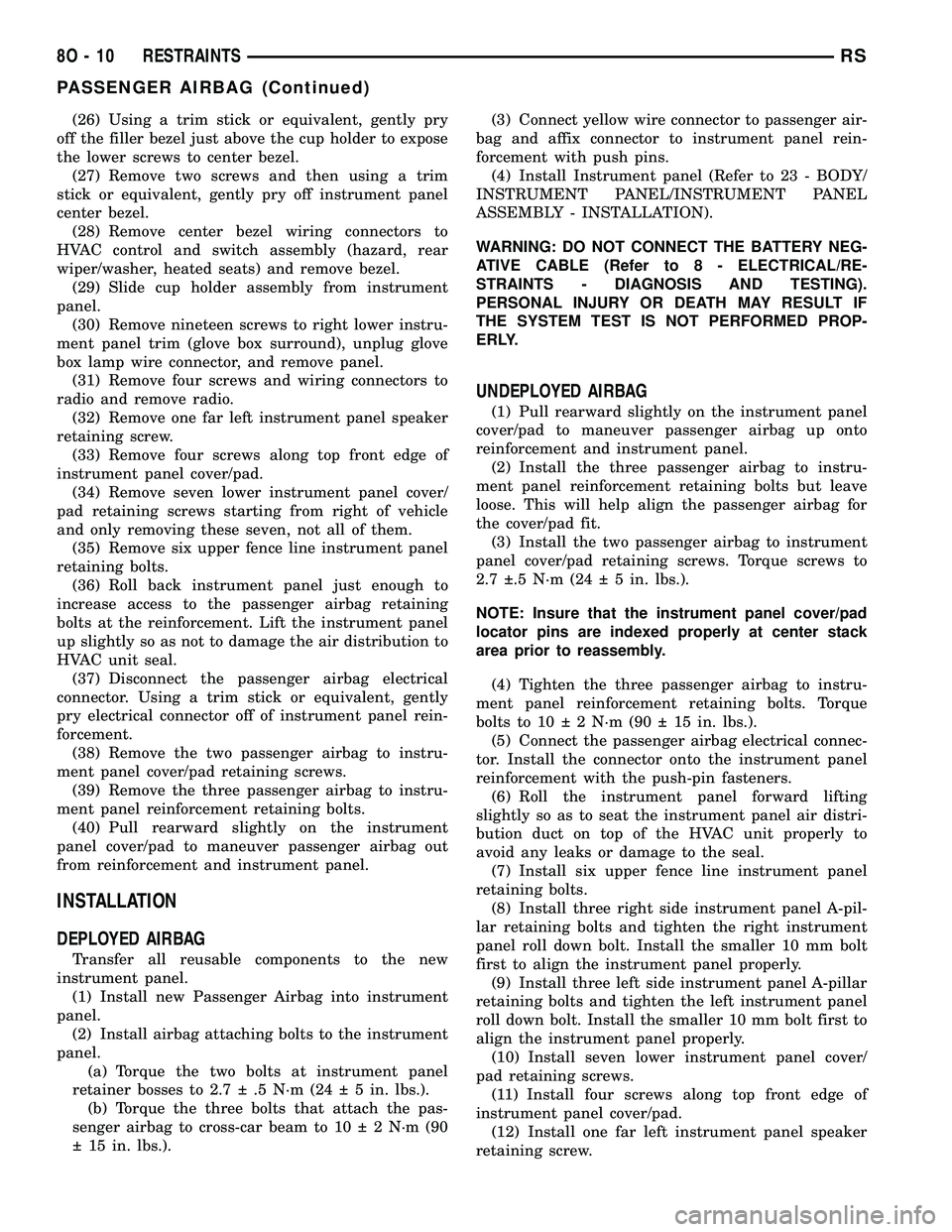DODGE TOWN AND COUNTRY 2004  Service Manual (26) Using a trim stick or equivalent, gently pry
off the filler bezel just above the cup holder to expose
the lower screws to center bezel.
(27) Remove two screws and then using a trim
stick or equiv