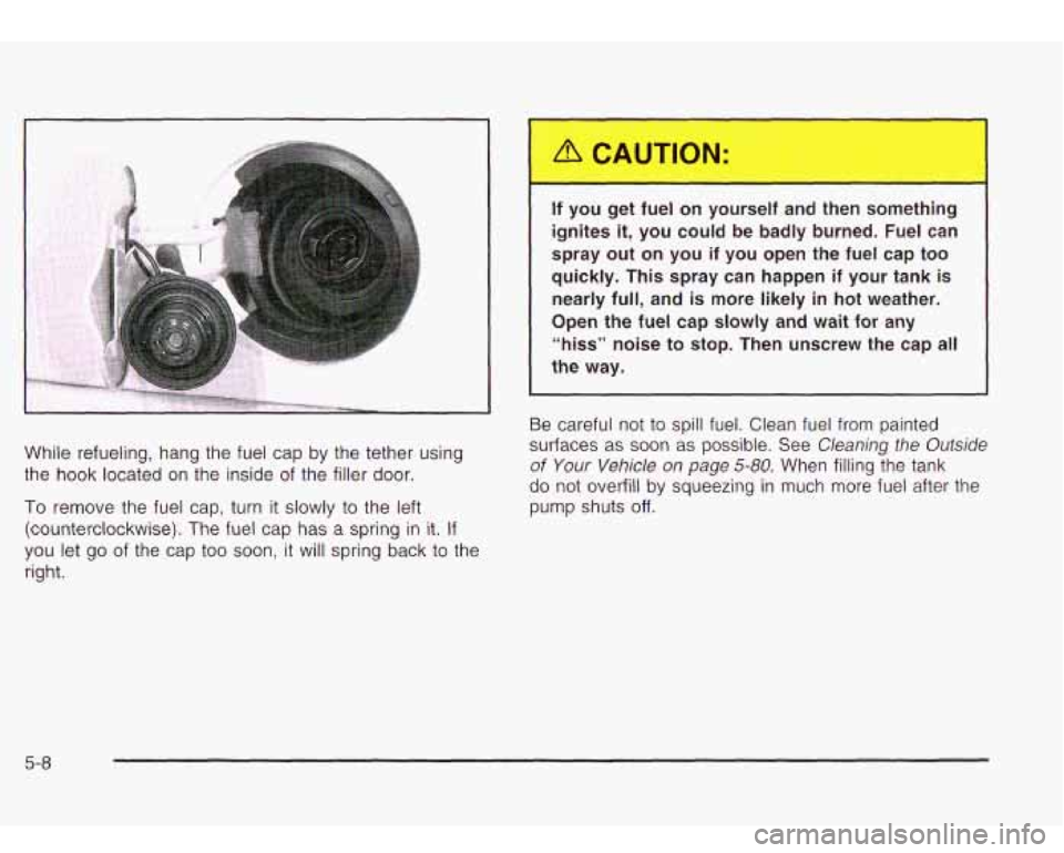 Oldsmobile Bravada 2003  Owners Manuals .- 
While refueling, hang the  fuel  cap  by the  tether  using 
the  hook  located  on  the inside of the  filler  door. 
To remove  the fuel  cap,  turn  it  slowly  to  the  left 
(counterclockwise
