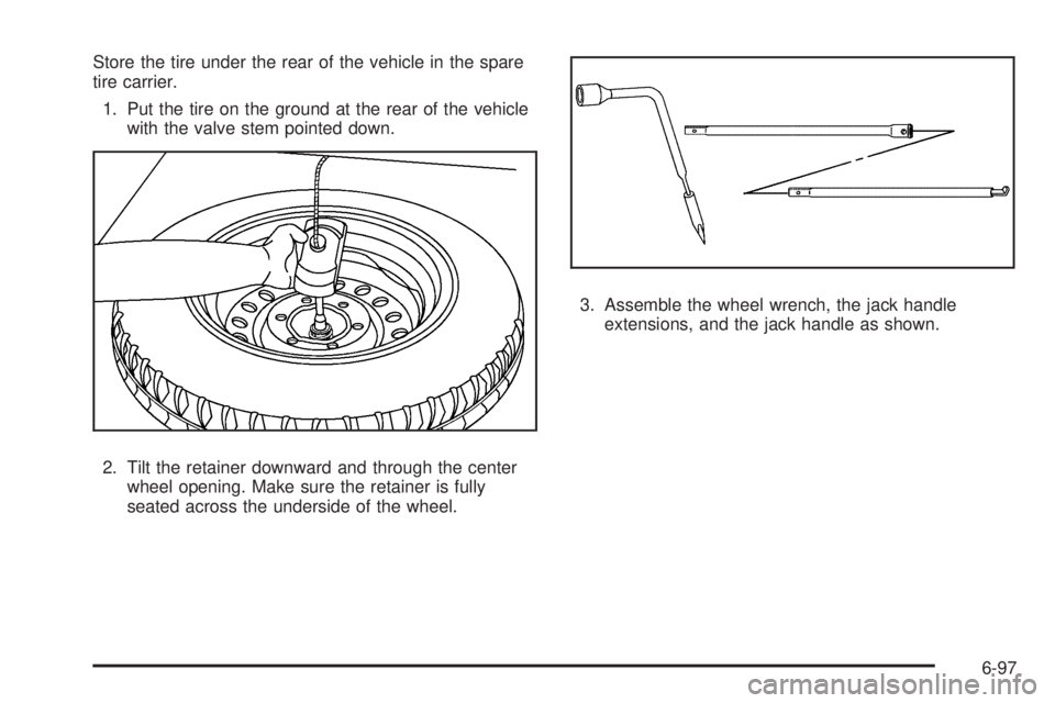 GMC CANYON 2010  Owners Manual Store the tire under the rear of the vehicle in the spare
tire carrier.
1. Put the tire on the ground at the rear of the vehicle
with the valve stem pointed down.
2. Tilt the retainer downward and thr