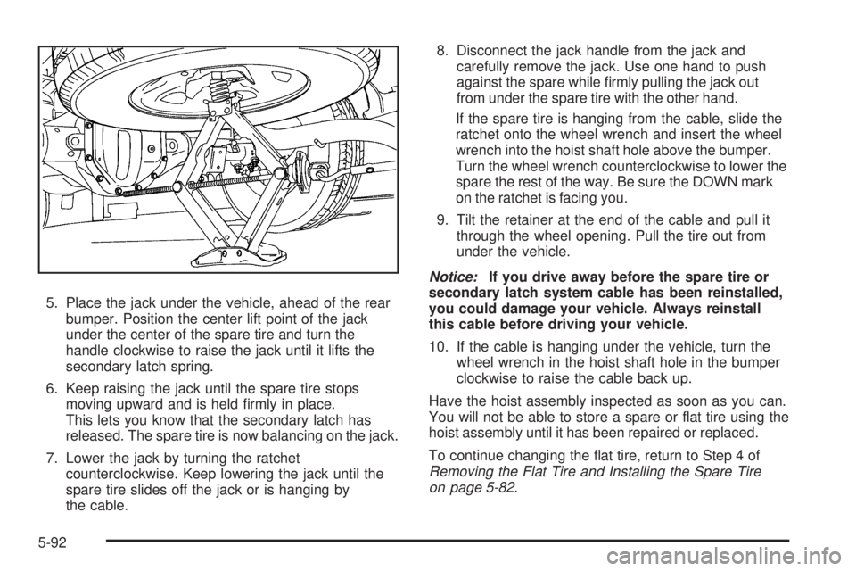 GMC SAVANA 2008  Owners Manual 5. Place the jack under the vehicle, ahead of the rear
bumper. Position the center lift point of the jack
under the center of the spare tire and turn the
handle clockwise to raise the jack until it li