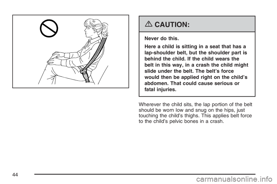 GMC ENVOY 2007  Owners Manual {CAUTION:
Never do this.
Here a child is sitting in a seat that has a
lap-shoulder belt, but the shoulder part is
behind the child. If the child wears the
belt in this way, in a crash the child might
