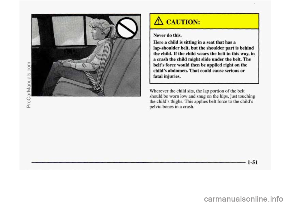 GMC ENVOY 1998  Owners Manual A CAUTION: 
Never do this. 
Here  a  child  is  sitting in 
a seat that  has a 
lap-shoulder  belt, but  the  shoulder  part is behind 
the  child. 
If the child  wears  the  belt in  this  way, in 
a