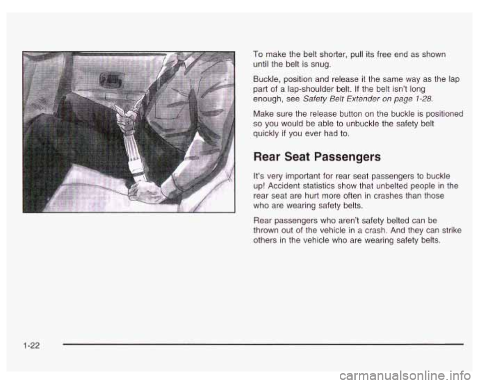 PONTIAC GRAND PRIX 2003  Owners Manual To make the belt shorter, pull its free  end  as  shown 
until the belt  is snug. 
Buckle,  position and  release 
it the  same  way  as  the lap 
part 
of a  lap-shoulder  belt. If the  belt isn’t 