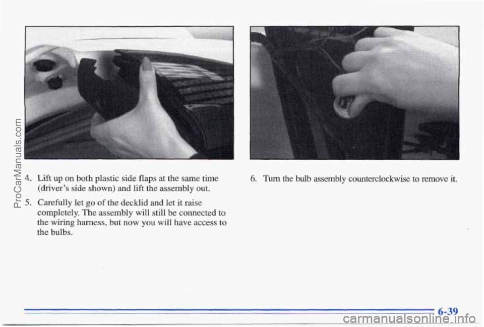 PONTIAC BONNEVILLE 1996  Owners Manual 4. Lift up on both  plastic  side  flaps  at  the  same  time 
(driver’s  side  shown)  and  lift  the  assembly  out. 
5. Carefully  let go of  the  decklid  and  let  it raise 
completely.  The as
